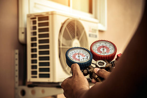 Professional Air Conditioning Service technician working in Parsonsfield, ME